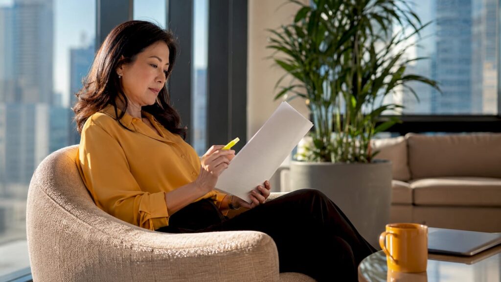 Businesswoman reviewing corporate transportation policy document